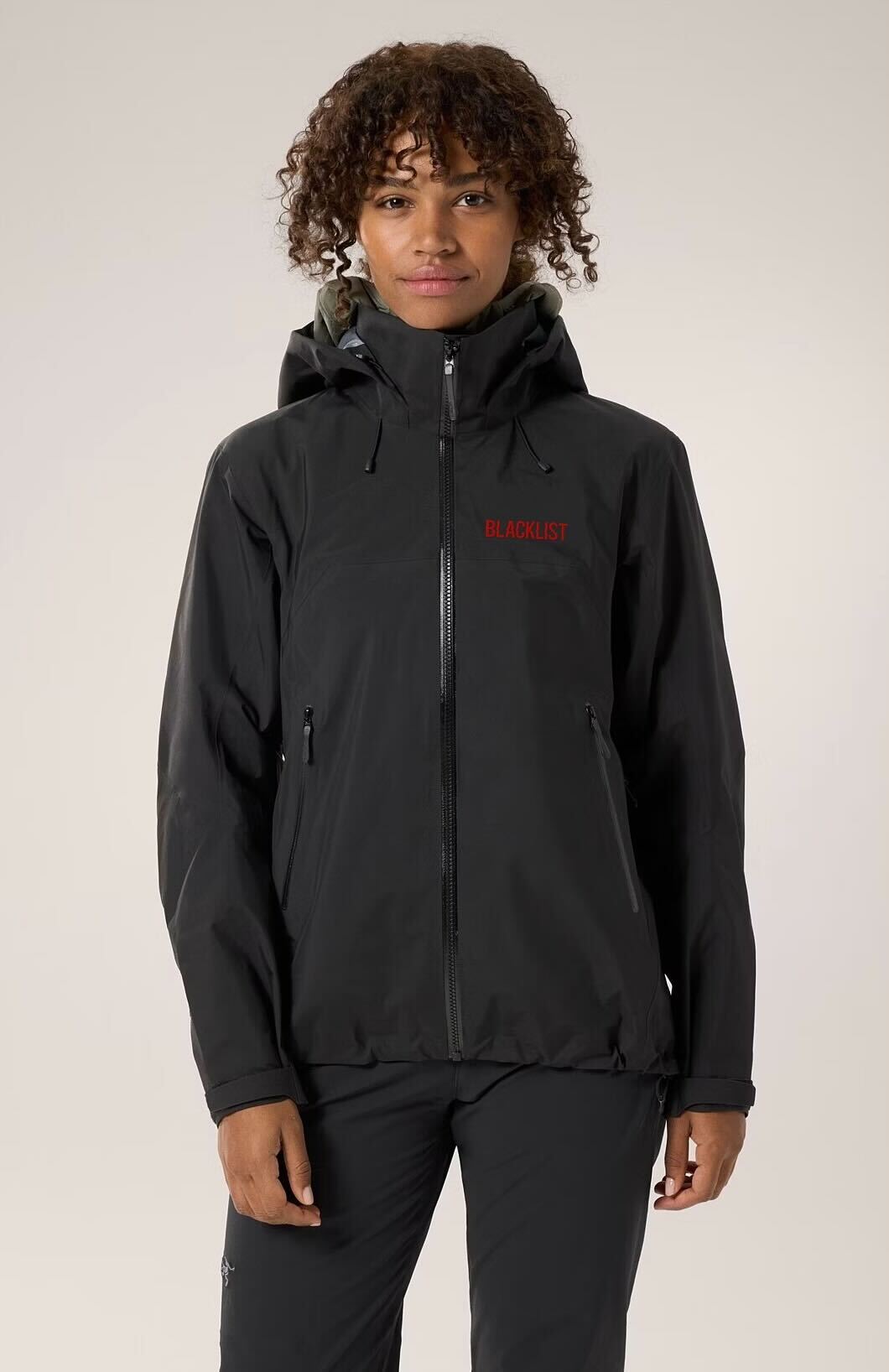 Sample: rain jacket with a show name embroidered on the chest
